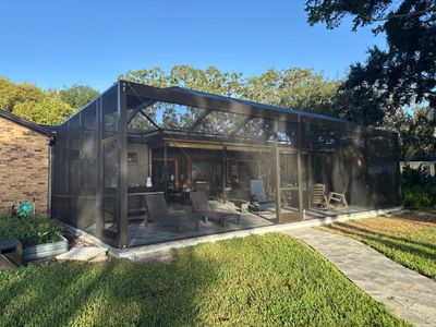Completed screen enclosure exterior by Drome Contracting