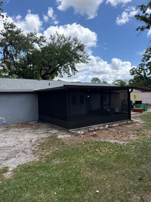 Completed screen room addition exterior by Drome Contracting